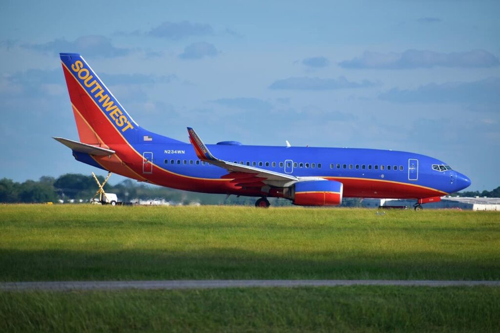 Southwest aircraft is taxiing on the runway of the airport