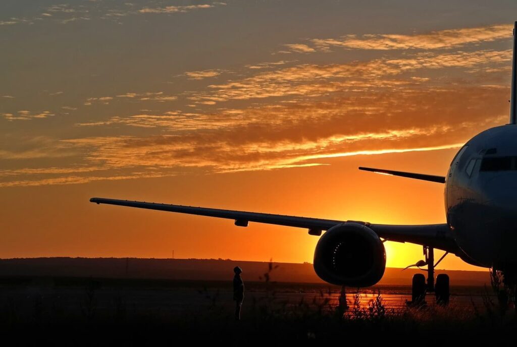 Aircraft on runway at suset