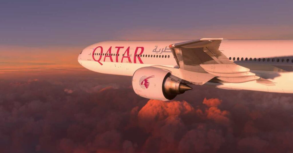 picture of a qatar airlines plane in the night sky